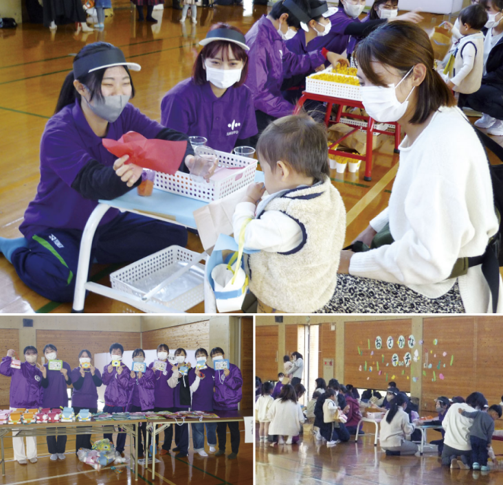 体育館で子どもが周囲に見守られながら制作活動をしている様子の写真